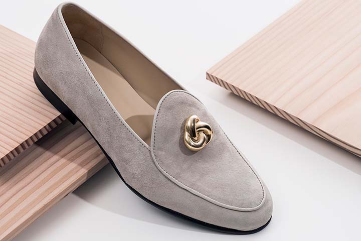 Handmade quality loafers in beige suede with unisex gold embellishment.